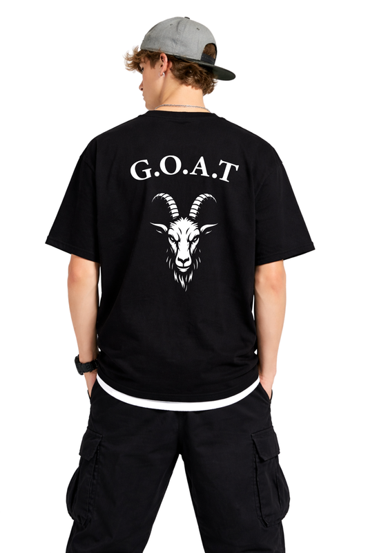 Person wearing a black t-shirt with 'G.O.A.T.' and a goat illustration on the back, standing against a white background.